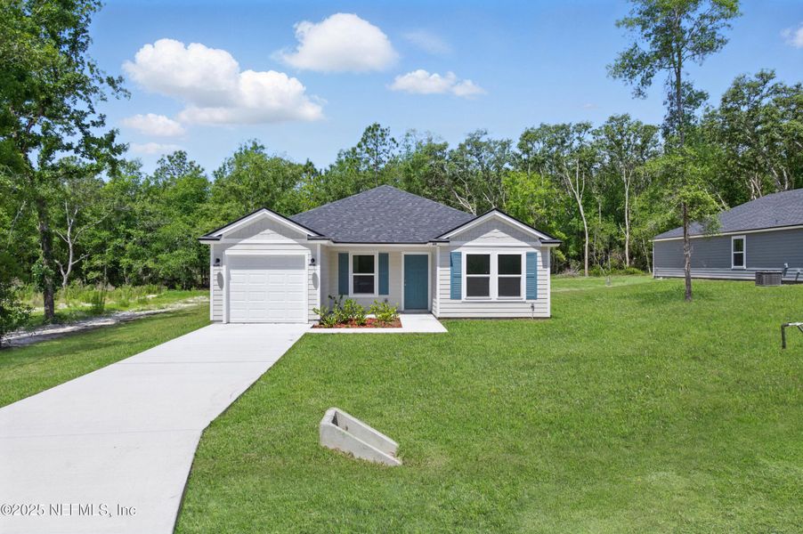 Front exterior of a new home in , Satsuma, FL, highlighting curb appeal (Image 2).