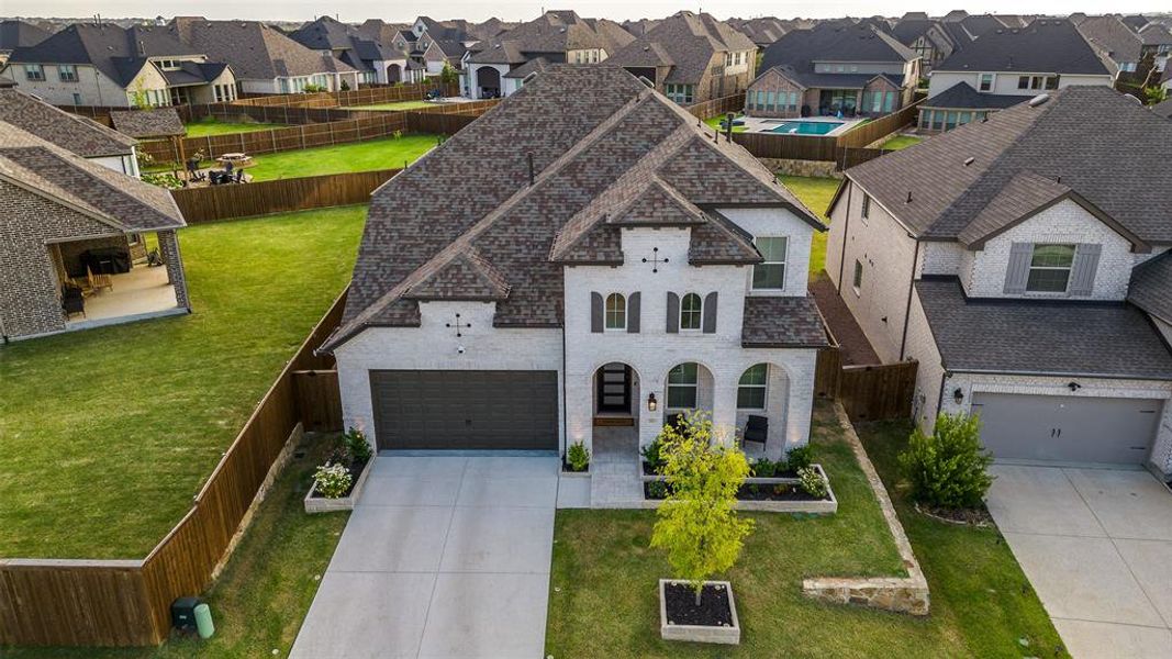 Front exterior of a new home in Sandbrock Ranch: 50ft. lots, Aubrey, TX, highlighting curb appeal (Image 19).