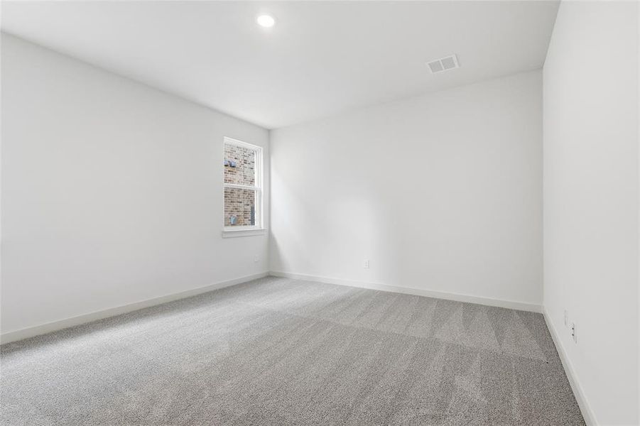 Empty room featuring carpet and baseboards Empty room featuring carpet and baseboards