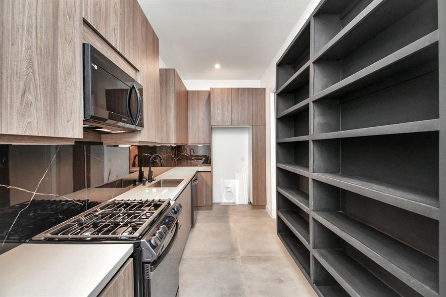 Second kitchen. Prepare all your meals here, and leave the main kitchen clean and free from clutter. Dedicated space for second refrigerator, and includes 2nd dishwash.