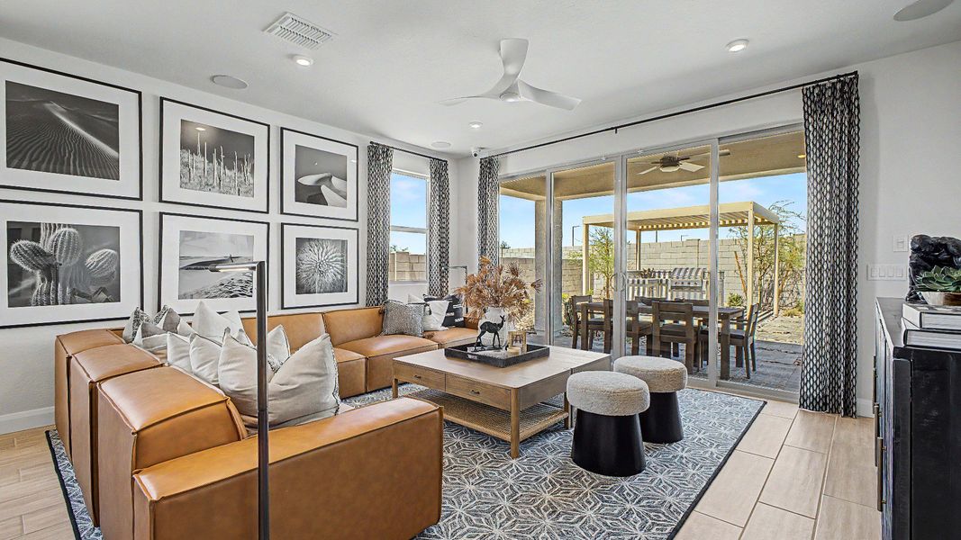 Great room looking into the covered patio in this quick move-in new home by DRB Homes at Saguaro Hills at Vistancia. Great room looking into the covered patio in this quick move-in new home by DRB Homes at Saguaro Hills at Vistancia.