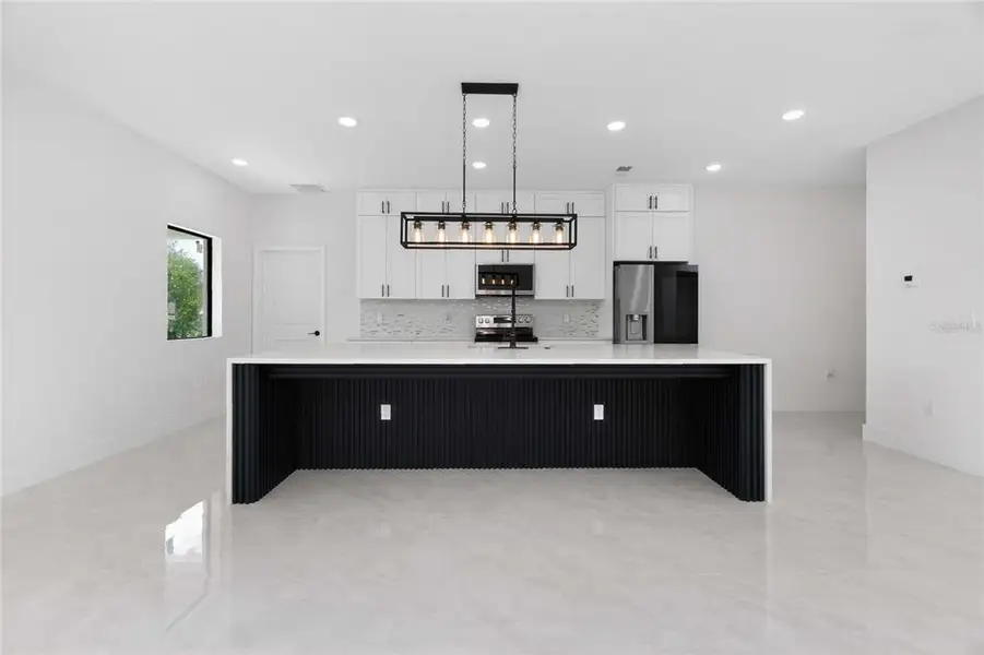Furnished interior view inside a new home in , Port Charlotte (Image 10).
