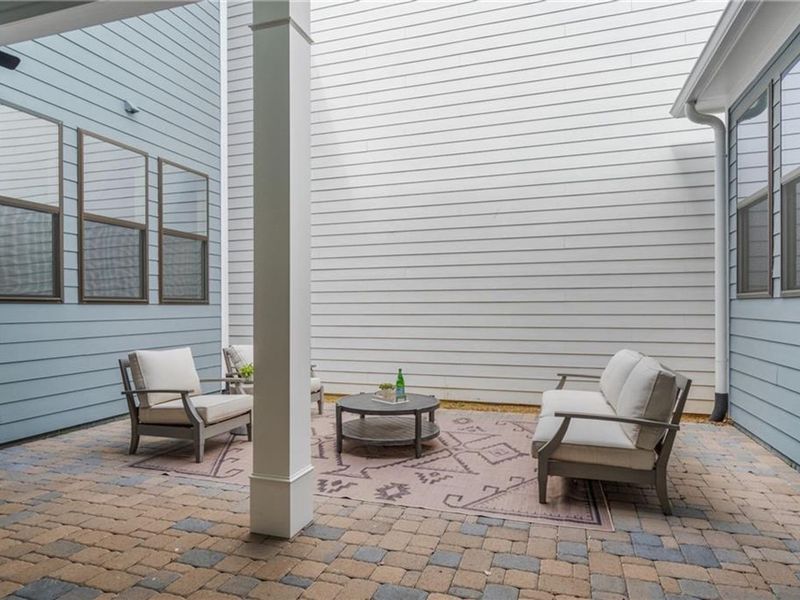 Exterior details and patio area of a home in The Village at Towne Lake, Woodstock (Image 33).