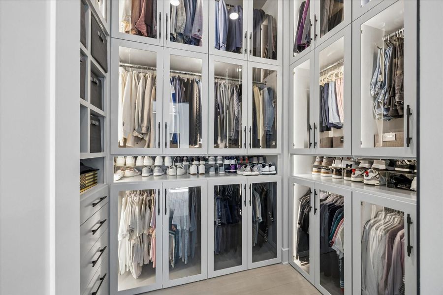 This is the smaller of the two primary closets. This is the smaller of the two primary closets.