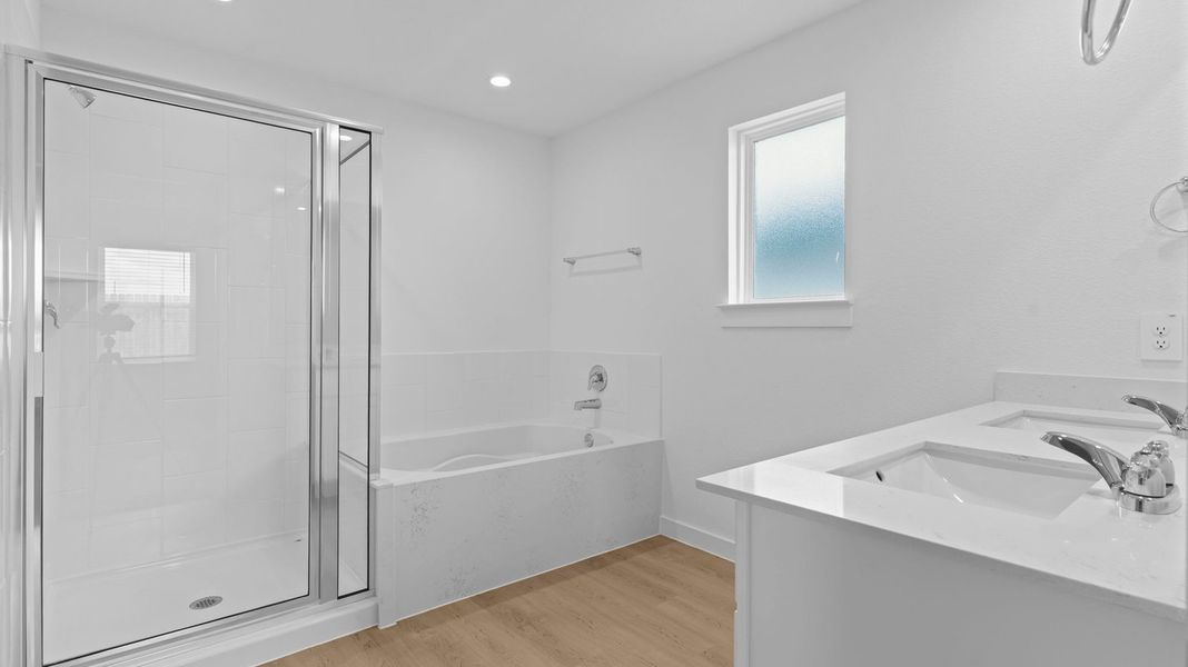 Representative furnished interior of a home built from the Kingston by D.R. Horton in Watermark, Alvin (Image 11).