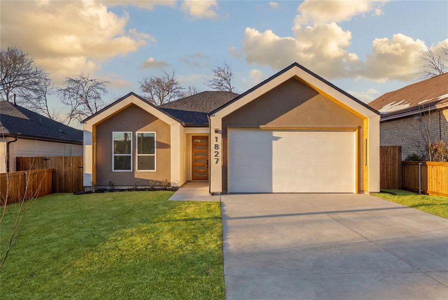 View of front facade with stucco siding, driveway, an attached garage, and a shingled roof View of front facade with stucco siding, driveway, an attached garage, and a shingled roof