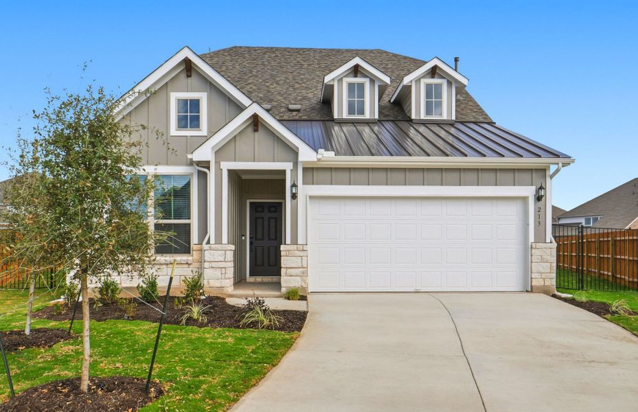 Front exterior of a new home in Santa Rita Ranch, Liberty Hill, TX, highlighting curb appeal (Image 22).