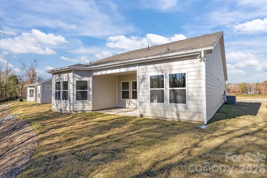 Exterior details and patio area of a home in Cottages at Wingate, Wingate (Image 4). Exterior details and patio area of a home in Cottages at Wingate, Wingate (Image 4).