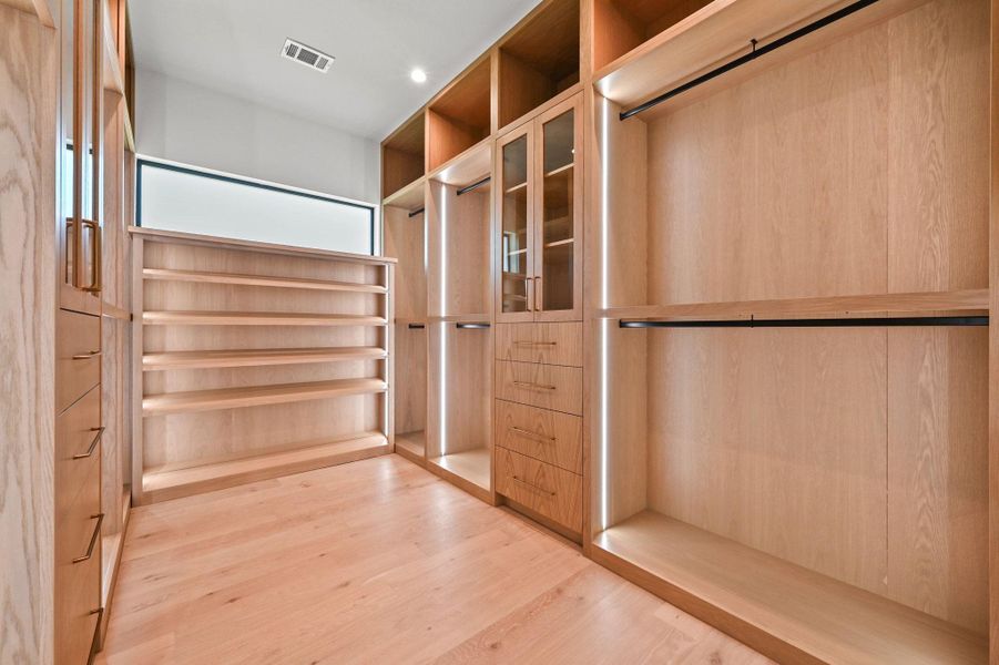 Walk in closet featuring light wood-style floors