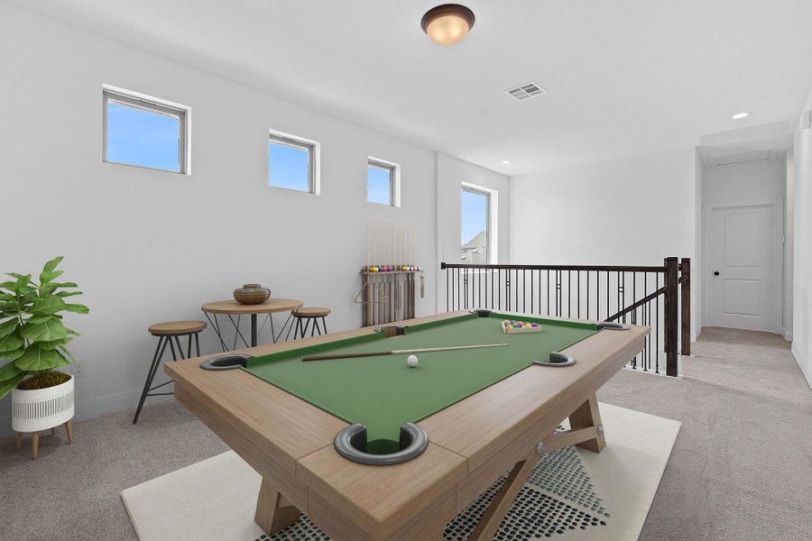 Recreation room with light colored carpet and billiards table