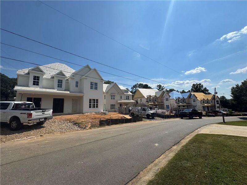 Front exterior of a new home in , Suwanee, GA, highlighting curb appeal (Image 2). Front exterior of a new home in , Suwanee, GA, highlighting curb appeal (Image 2).
