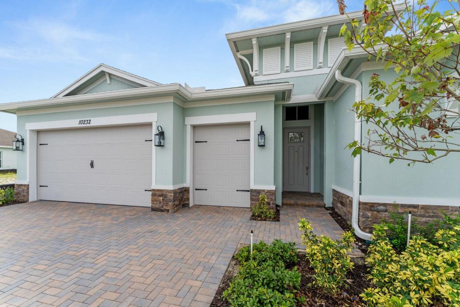 Front exterior of a new home in , Port St. Lucie, FL, highlighting curb appeal (Image 26). Front exterior of a new home in , Port St. Lucie, FL, highlighting curb appeal (Image 26).