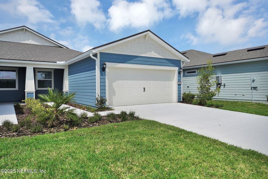 Front exterior of a new home in , Yulee, FL, highlighting curb appeal (Image 20).