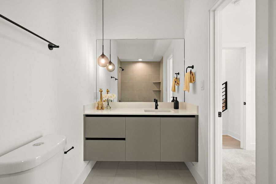 The secondary bathroom in first floor offers a warm, inviting ambiance with tasteful design elements throughout. A simple yet charming half bathroom located on the second floor.**Images shown are from a similar model. Actual features may vary. The secondary bathroom in first floor offers a warm, inviting ambiance with tasteful design elements throughout. A simple yet charming half bathroom located on the second floor.**Images shown are from a similar model. Actual features may vary.