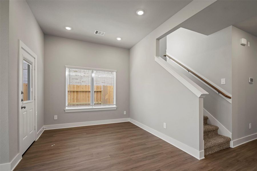 Bright dining space overlooking the backyard, ideal for both family meals and entertaining guests. Bright dining space overlooking the backyard, ideal for both family meals and entertaining guests.