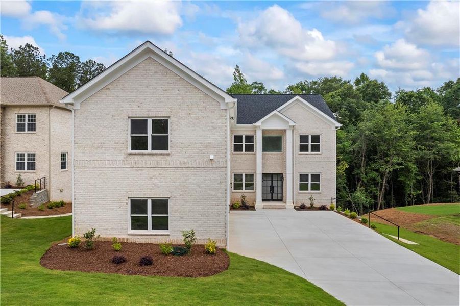 Front exterior of a new home in , Fairburn, GA, highlighting curb appeal (Image 1).