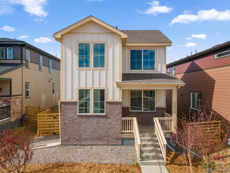 Front exterior of a new home in The Casitas Collection at Windler, Aurora, CO, highlighting curb appeal (Image 1). Front exterior of a new home in The Casitas Collection at Windler, Aurora, CO, highlighting curb appeal (Image 1).