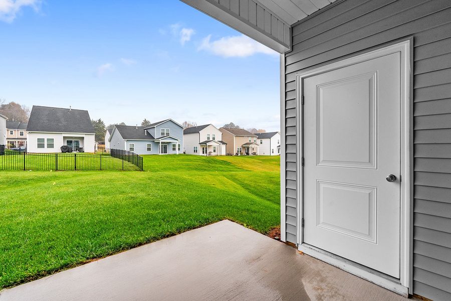 Exterior details and patio area of a home in Hanes Lake, Winston-Salem (Image 3).