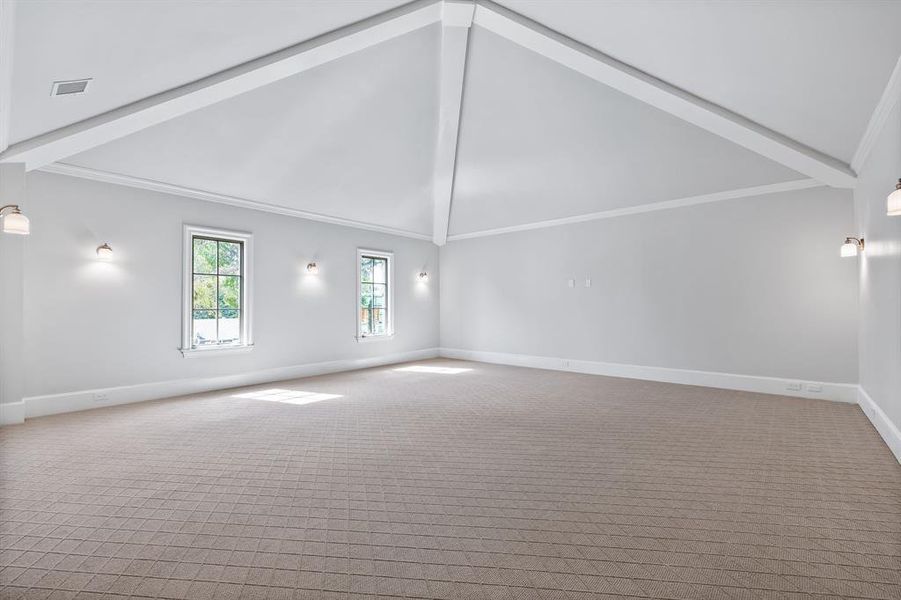 Media room with high vaulted ceiling, beam ceiling, and ornamental molding Media room with high vaulted ceiling, beam ceiling, and ornamental molding