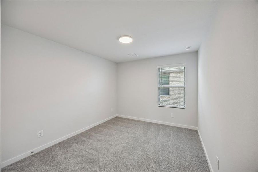 Bedroom in the Oak II home plan by Trophy Signature Homes – REPRESENTATIVE PHOTO