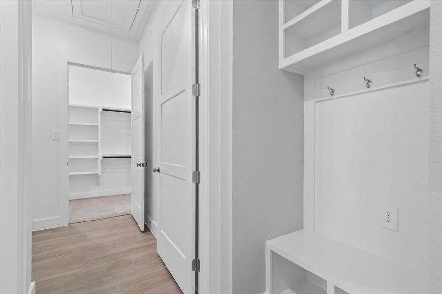 The ultimate in organization and cleanliness—a dedicated mudroom designed to manage daily life with ease. This highly desirable space serves as the perfect "drop zone" between the outdoors and your main living areas, helping to keep your home tidy and clutter-free.