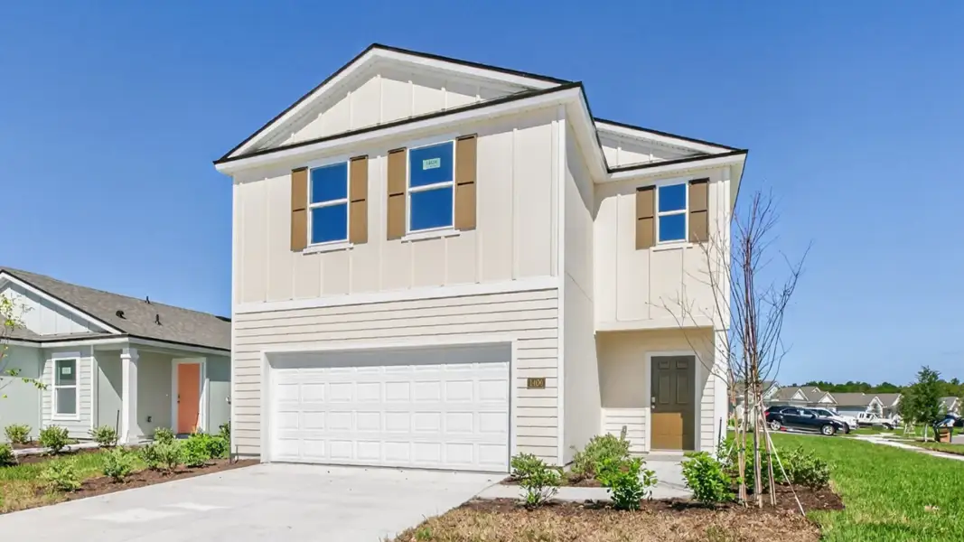 Front exterior of a new home in Rookery, Green Cove Springs, FL, highlighting curb appeal (Image 1). Front exterior of a new home in Rookery, Green Cove Springs, FL, highlighting curb appeal (Image 1).