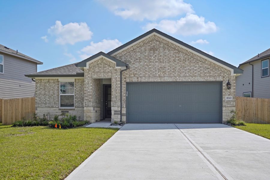 Front exterior of a new home in Landing Meadows - Premier Series, New Caney, TX, highlighting curb appeal (Image 2). Front exterior of a new home in Landing Meadows - Premier Series, New Caney, TX, highlighting curb appeal (Image 2).