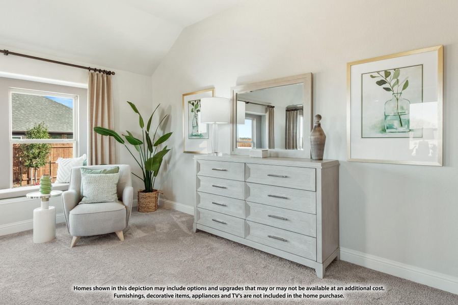 Bedroom with vaulted ceiling, light gray dresser with mirror, accent chair, and carpet flooring Bedroom with vaulted ceiling, light gray dresser with mirror, accent chair, and carpet flooring