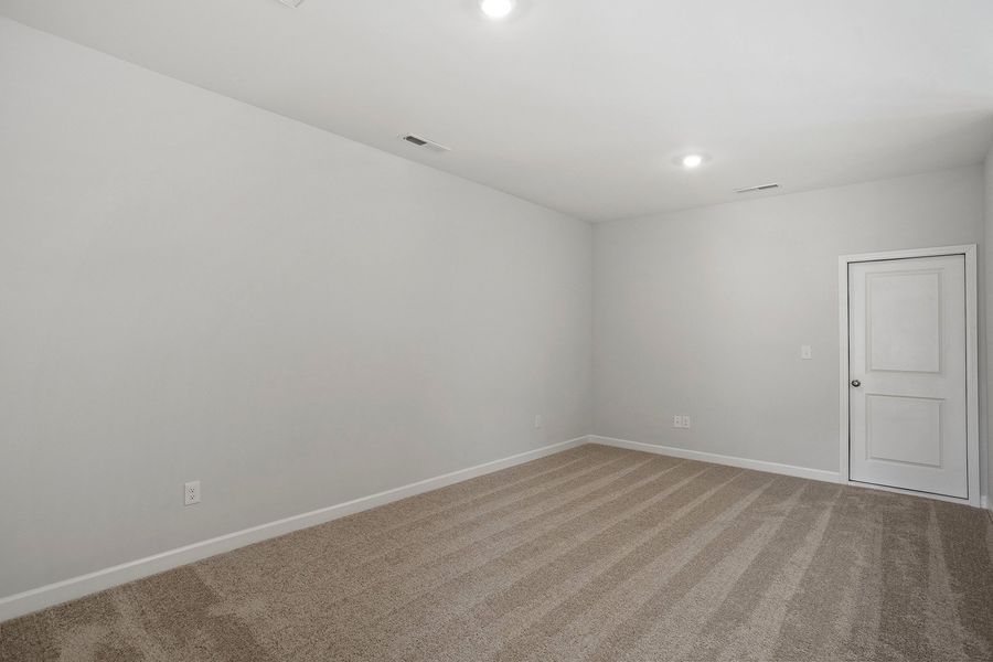 Spacious, unfurnished interior of a new home in Ovation at Sweetbrier, Durham (Image 25).