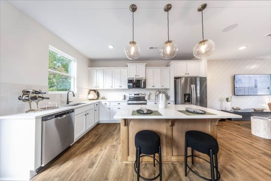 Representative furnished interior of a home built from the Myka TH by True Homes in Village at Reedy Creek Townhomes, Charlotte (Image 3).