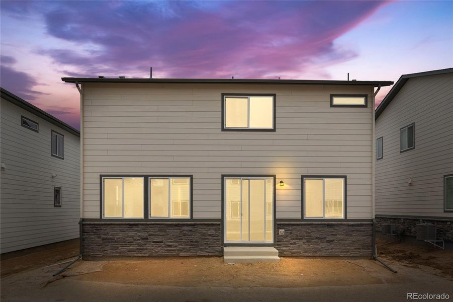 Exterior details and patio area of a home in Harvest Crossing, Aurora (Image 13).