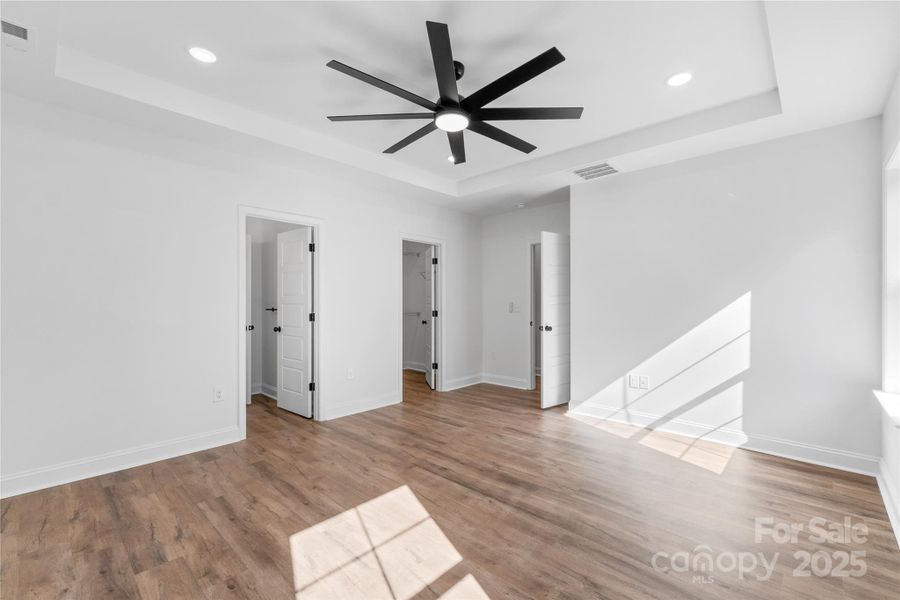 primary bedroom w/ tray ceiling primary bedroom w/ tray ceiling