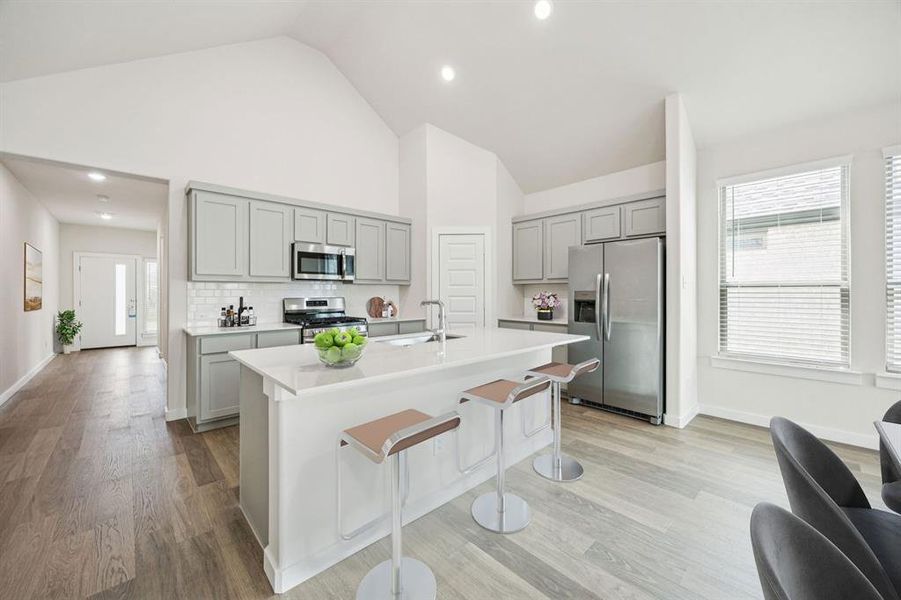 Kitchen in the Claret home plan by Trophy Signature Homes – REPRESENTATIVE PHOTO