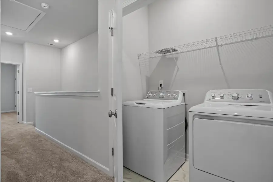 Furnished interior view inside a new home in West Main Townhomes, Sanford (Image 11).