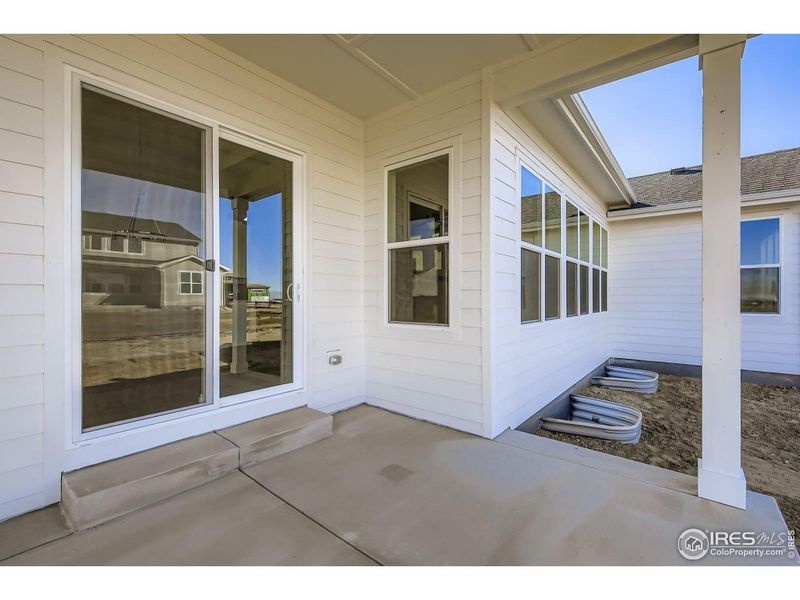 Exterior details and patio area of a home in RainDance, Windsor (Image 18).
