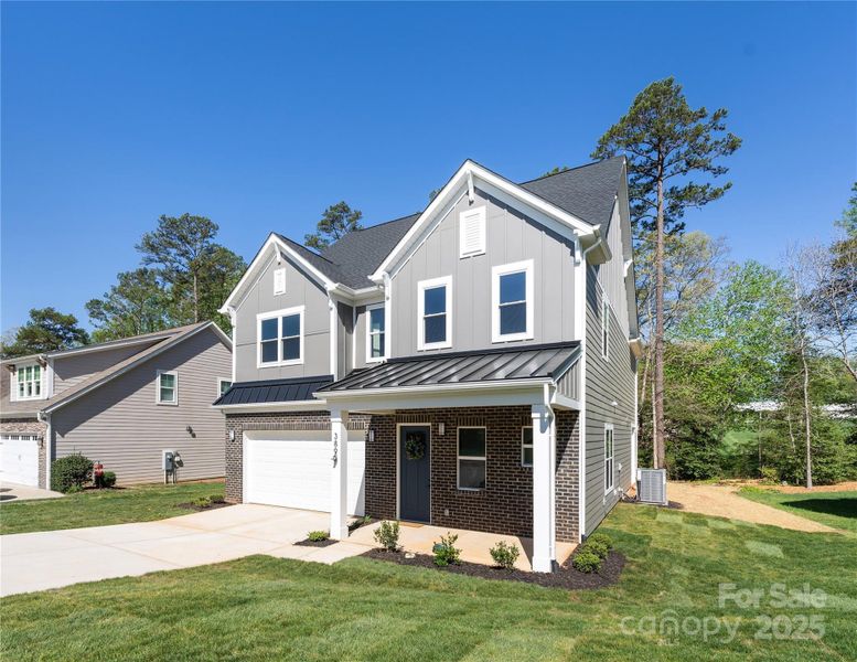 Front exterior of a new home in , Hickory, NC, highlighting curb appeal (Image 25).