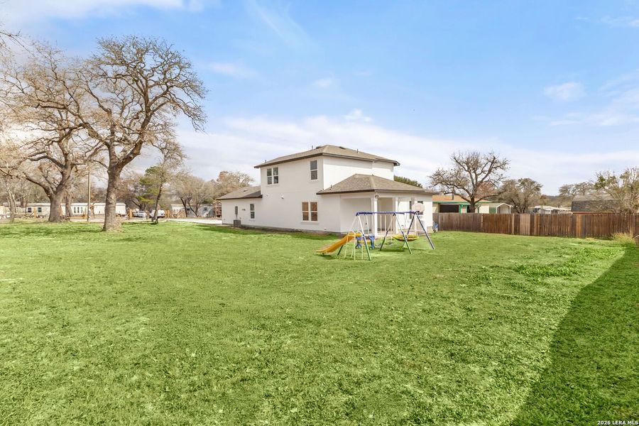 Exterior details and patio area of a home in , Elmendorf (Image 3).