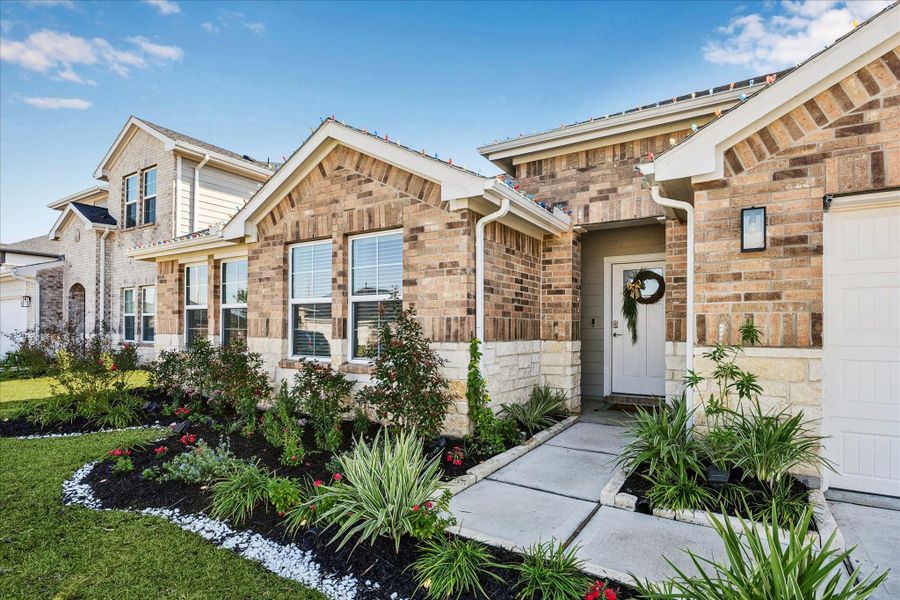 Front exterior of a new home in Tamarron, Fulshear, TX, highlighting curb appeal (Image 2). Front exterior of a new home in Tamarron, Fulshear, TX, highlighting curb appeal (Image 2).