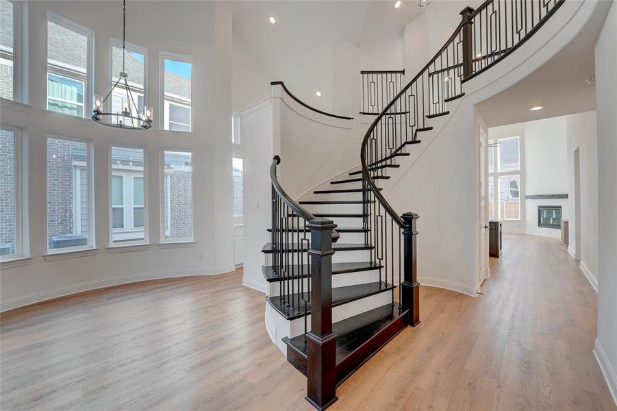 Foyer entrance with vinyl finished floors, a wealth of natural light, and baseboards