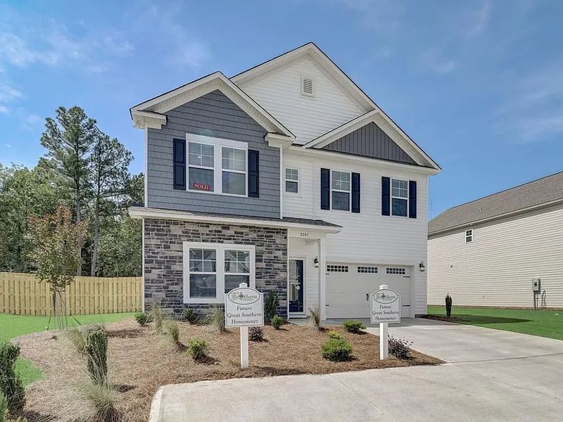 Front exterior of a new home in Providence Station at Trolley Run, Aiken, SC, highlighting curb appeal (Image 2).