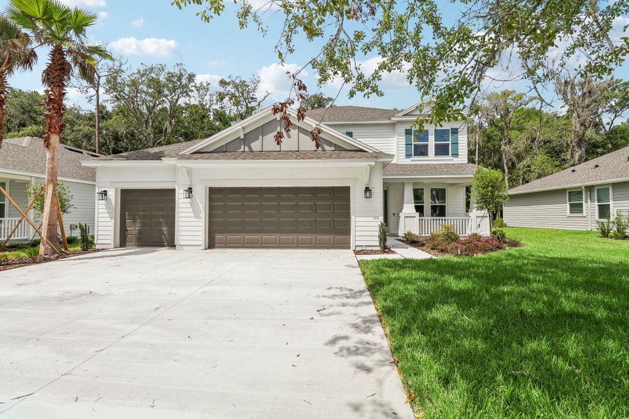 Representative exterior photo of a completed home built from the Lorenzo by Taylor Morrison in Osprey Cove, St. Marys, GA (Image 1). Representative exterior photo of a completed home built from the Lorenzo by Taylor Morrison in Osprey Cove, St. Marys, GA (Image 1).