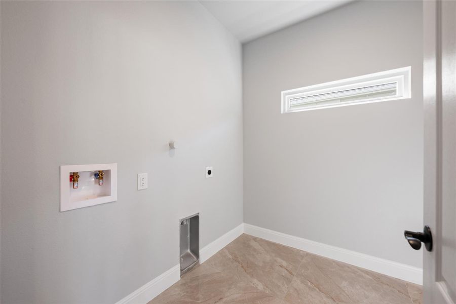 Laundry room with washer hookup and electric dryer hookup