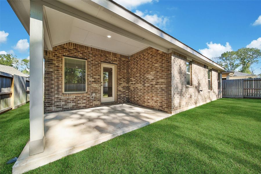 Exterior details and patio area of a home in The Highlands: Richmond Collections, Porter (Image 20).