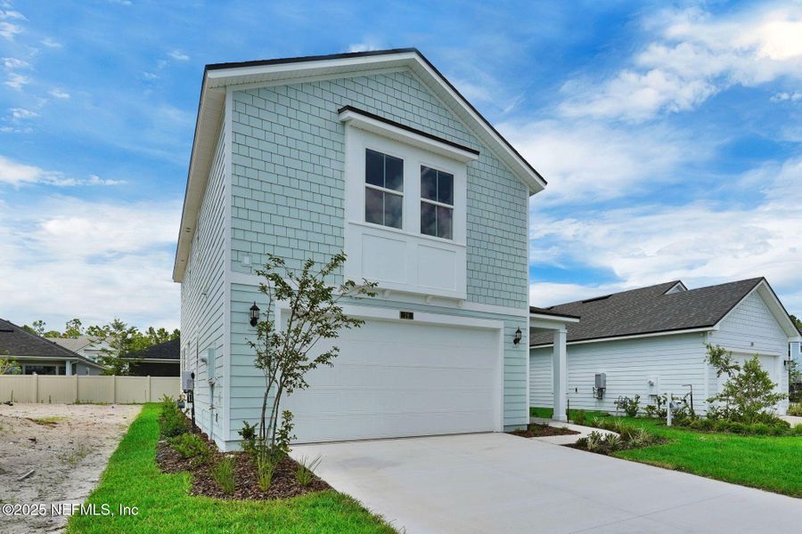 Front exterior of a new home in Reflections at Nocatee, Ponte Vedra, FL, highlighting curb appeal (Image 18).