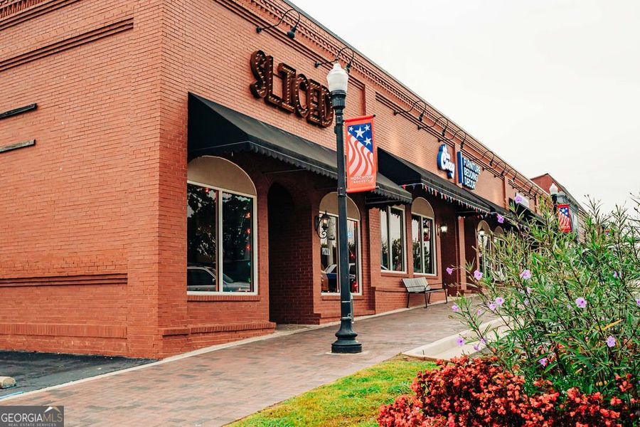 Front exterior of a new home in Rosewood Lake Estates, Hoschton, GA, highlighting curb appeal (Image 63).