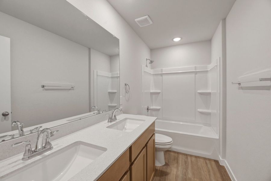 Furnished interior view inside a new home in Highland Ridge, New Braunfels (Image 9).