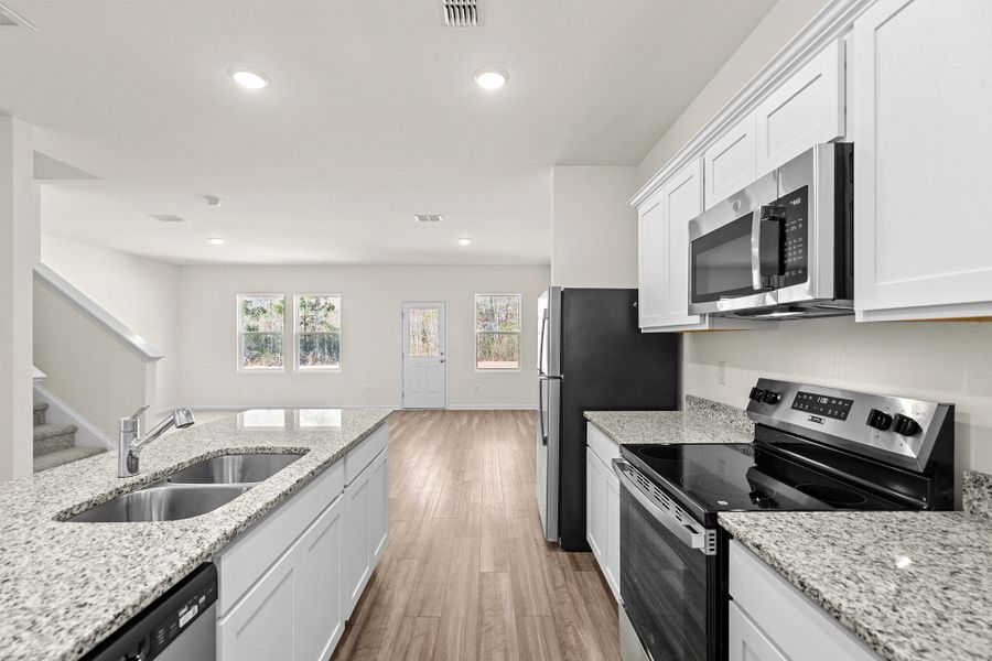 Representative furnished interior of a home built from the Highland by Starlight Homes in Sutton Farms, San Antonio (Image 9).