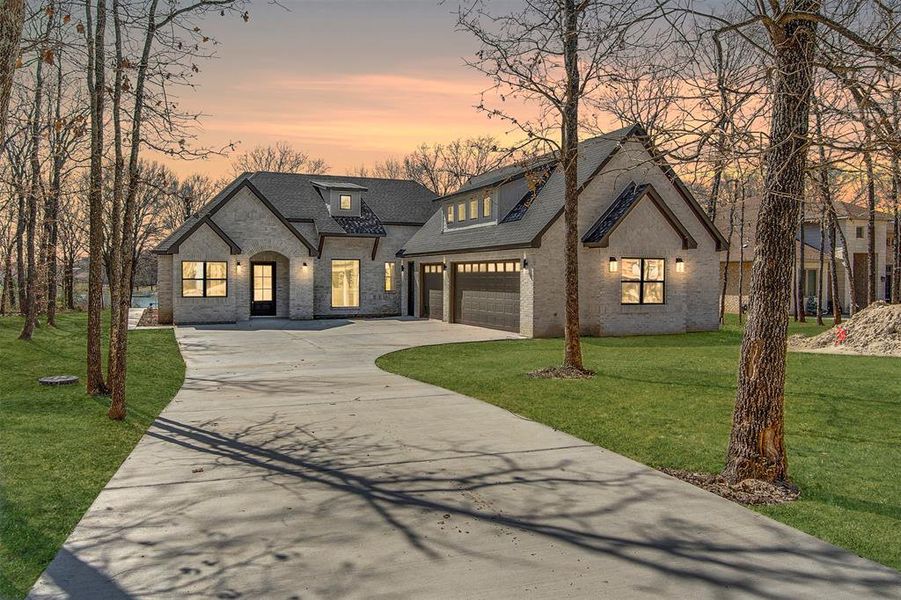 Front exterior of a new home in , Ennis, TX, highlighting curb appeal (Image 20).