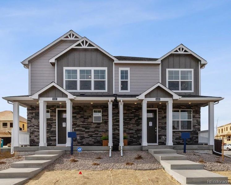Front exterior of a new home in Settlers Crossing, Commerce City, CO, highlighting curb appeal (Image 1).