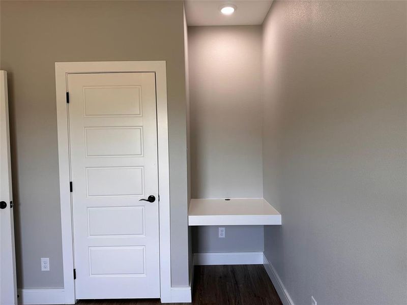 Secondary bedroom has a built-in desk. Closet. Ceiling fan.